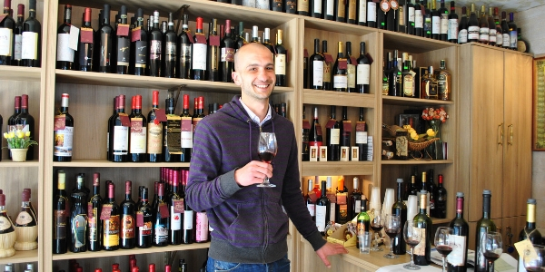 Man Tasting Wine at Retail Store